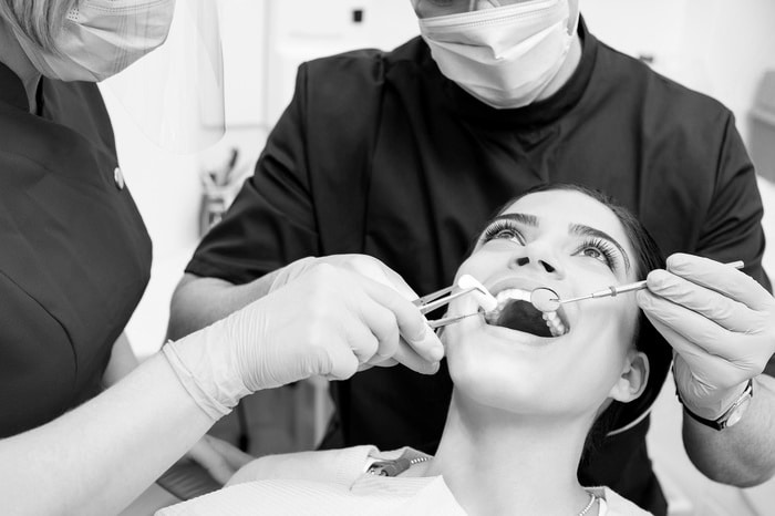 Use your dental benefits! 2 Woman getting teeth worked on, representing dental benefits